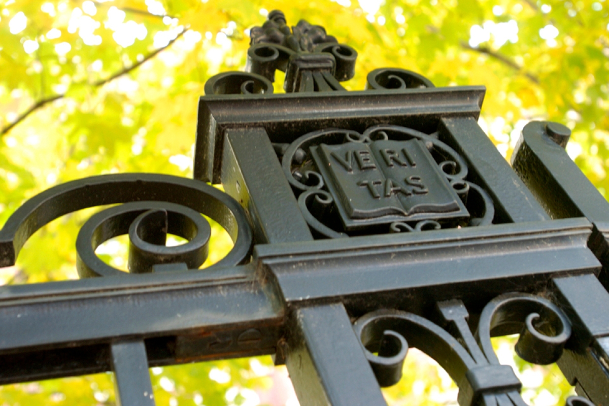 Veritas written on gate in Harvard Yard